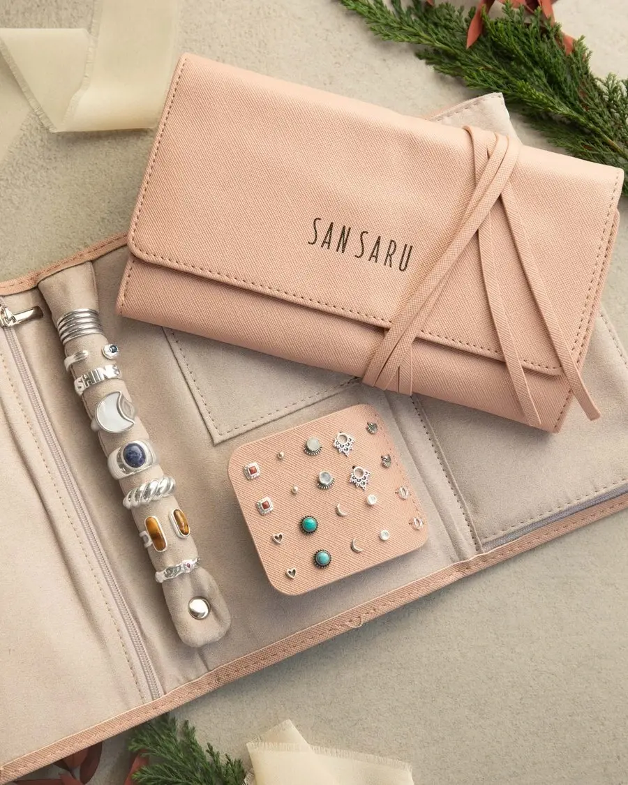 San Saru jewelry roll with silver rings and earrings
